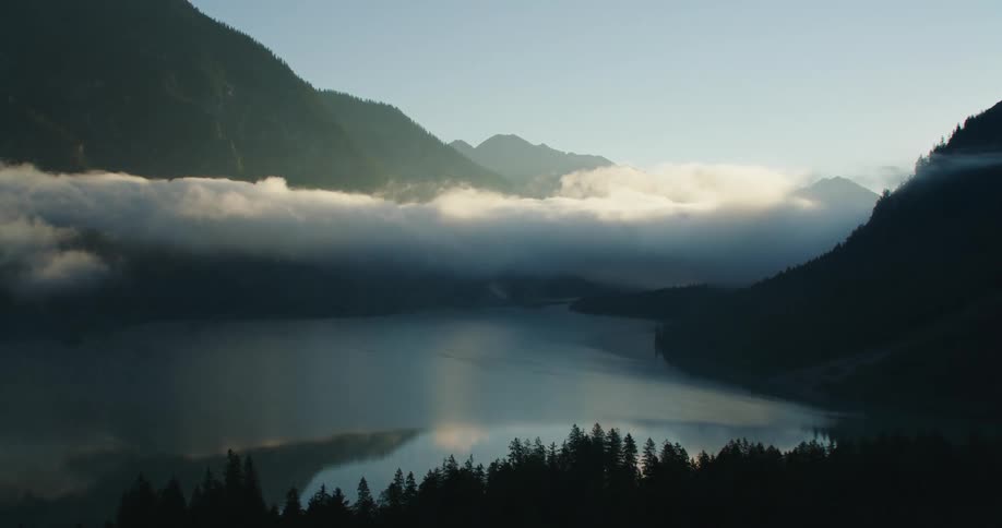 The clouds are low over the lake