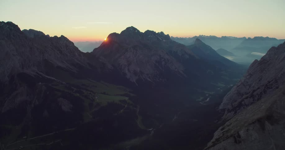 Mountains and peaks near a sunrise