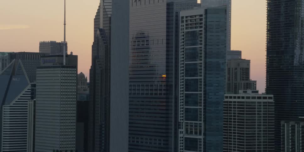 Aerial view of buildings as the sun sets