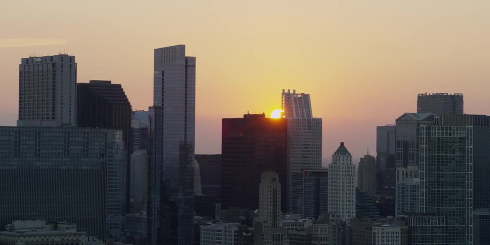 The sun is setting behind this city