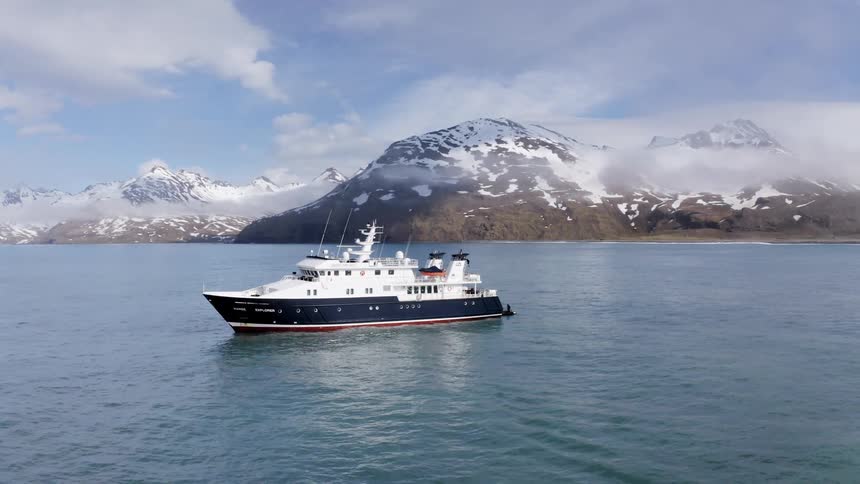 A boat is driving across the ocean