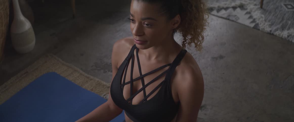 A woman is doing yoga indoors