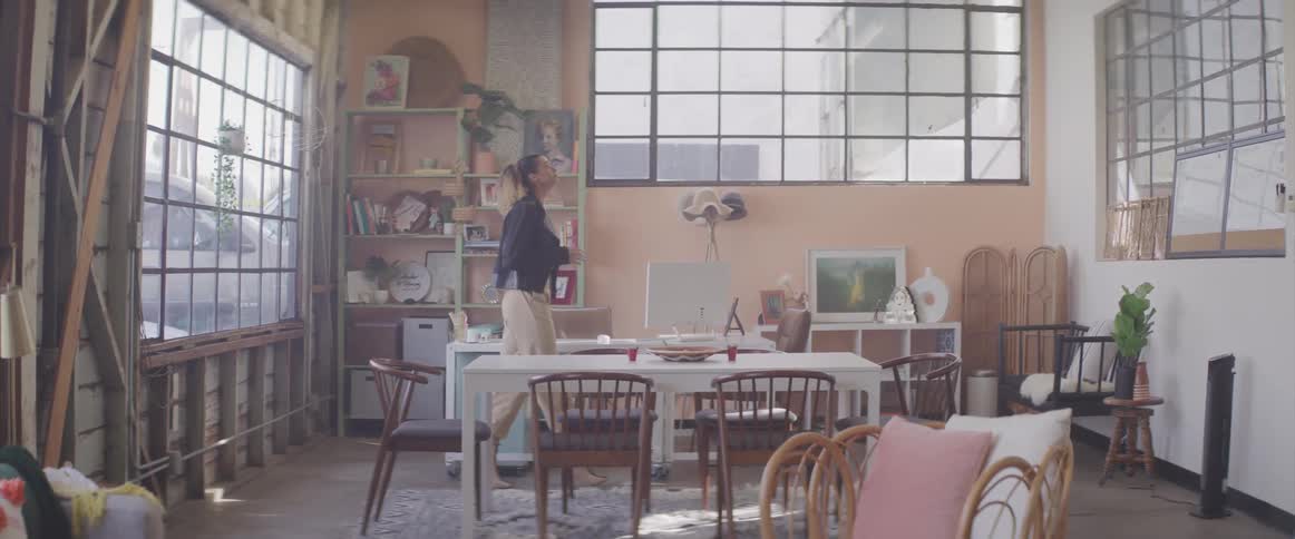 Young woman pacing nervously in dining area at home
