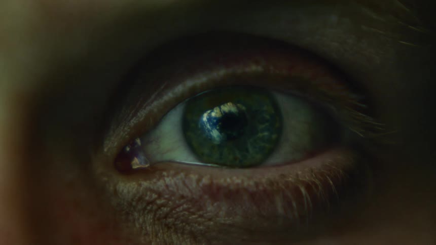 A person blinks their eye