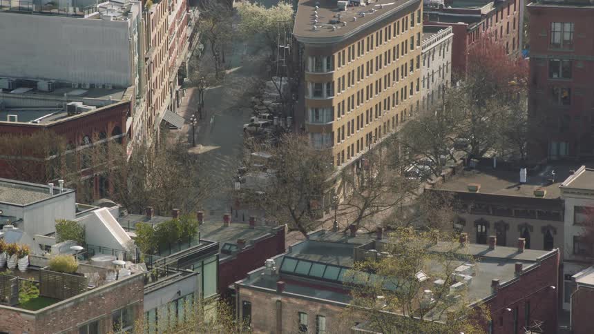 Cars parked next to buildings in a neighborhood
