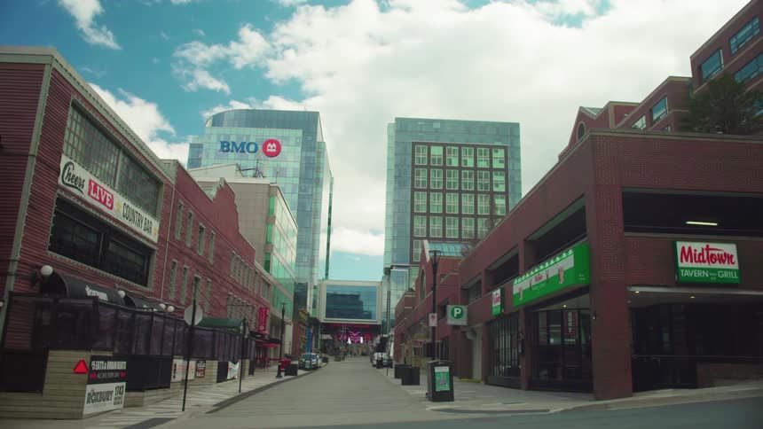 The city street is empty during the day