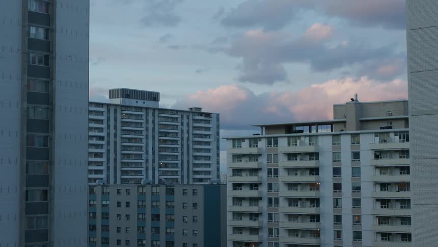 The clouds surround the buildings