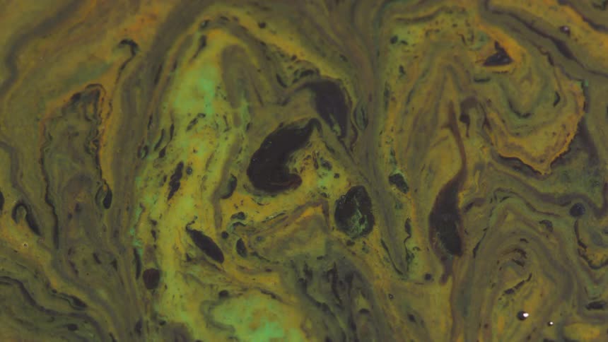 Flowing green and yellow paint