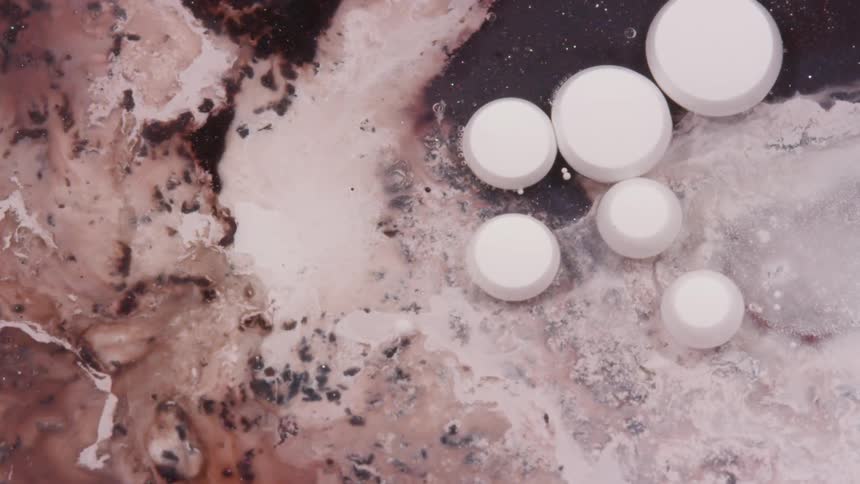 Movement of white and brown liquid