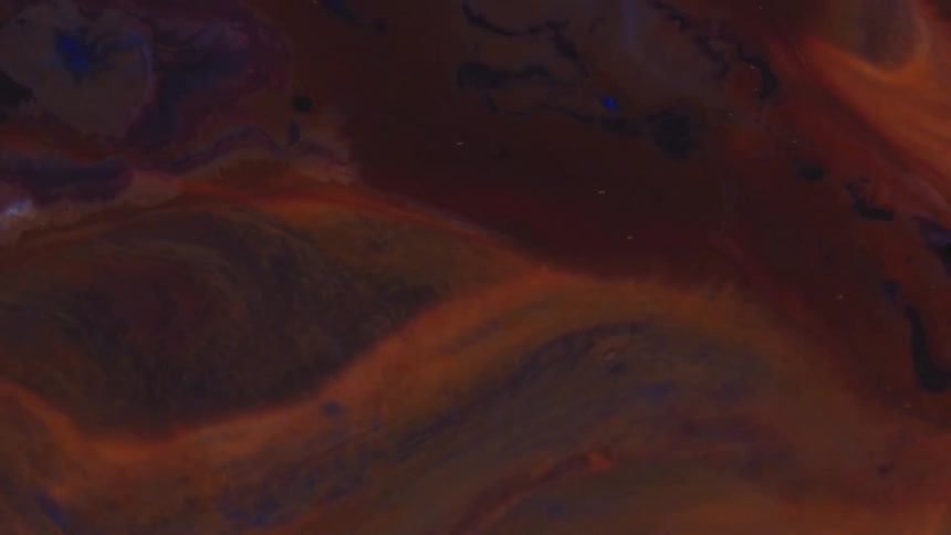 Swirling orange and blue liquid