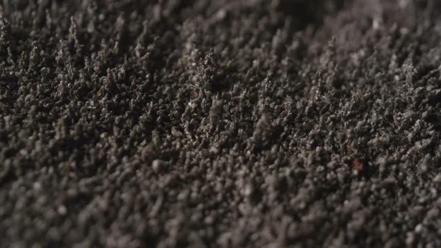Brown gray and black colors that look like soil moving