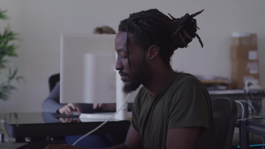 People are working on computers in the office