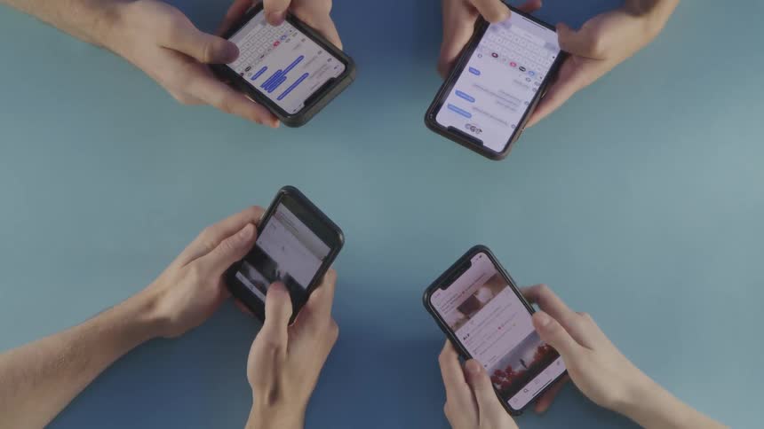 People are texting on cell phones
