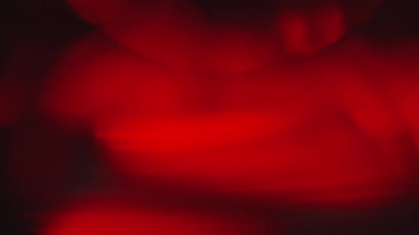 The red light rolls around in the dark