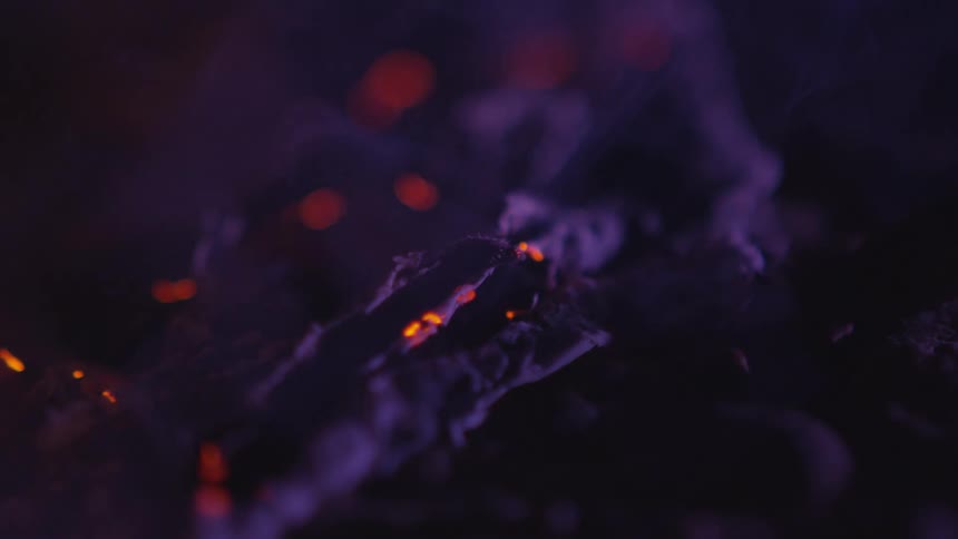 A fire burning out and smoking