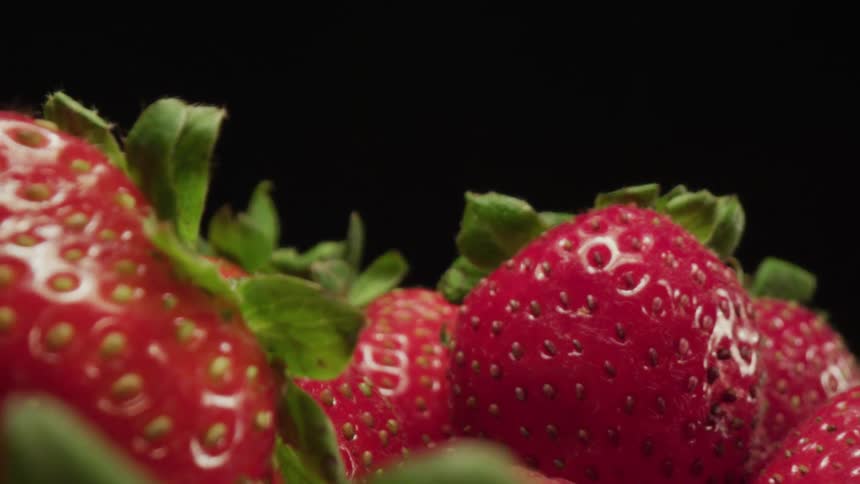 Multiple strawberries are on display
