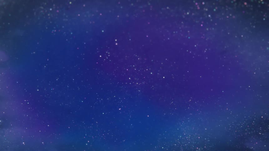 Glitter swirling in blue liquid