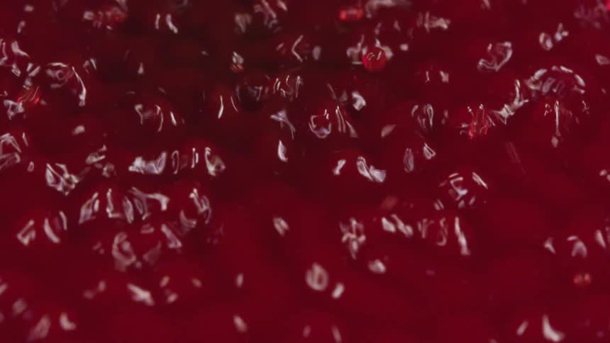 Bubbling and rippling red liquid