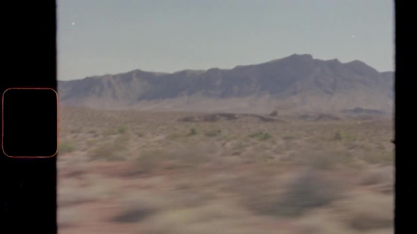 Passing plain bordering mountain under clear blue sky