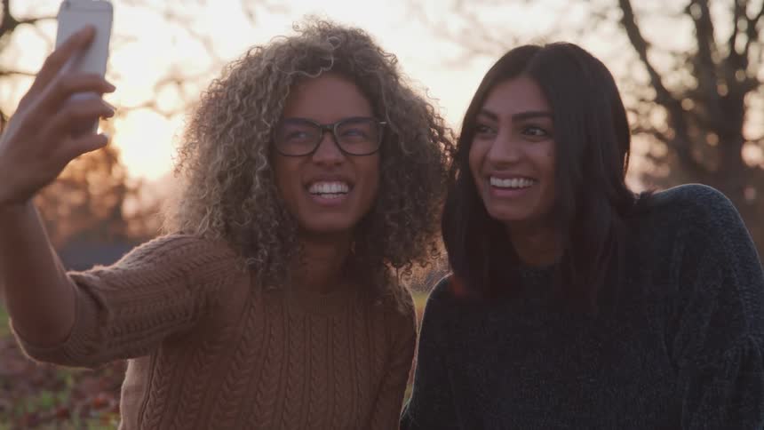 Two women take selfie at sunrise