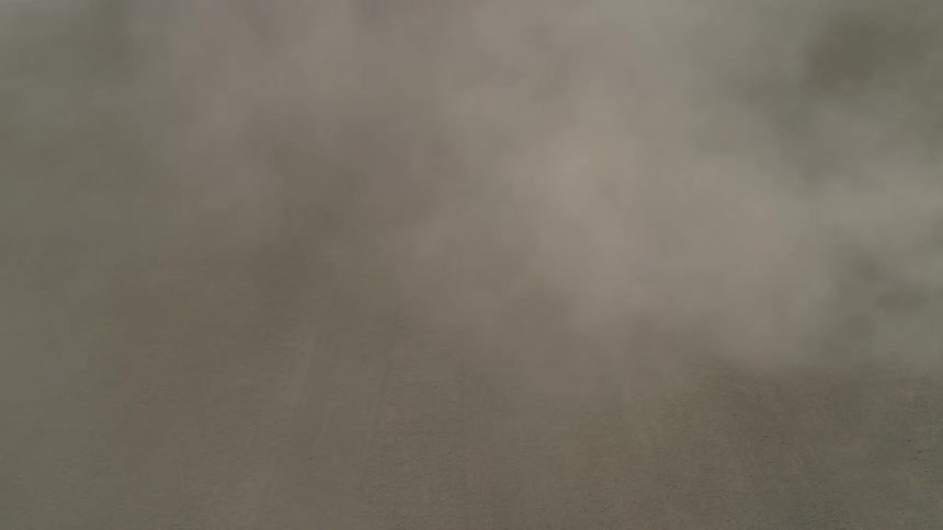White gray and black colors that look like the sky clouds and land