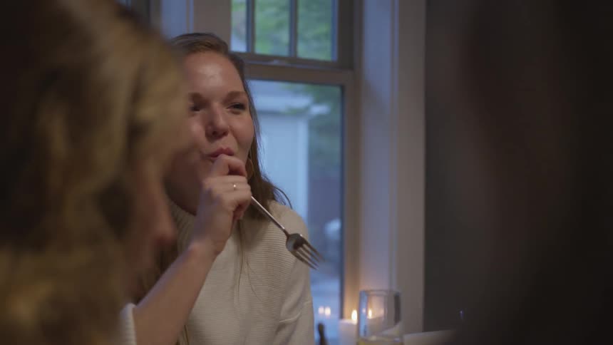 Group of friends and family have dinner at home
