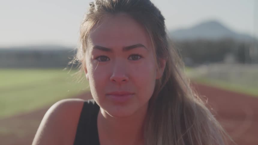 A teenage girl on a track in a public park