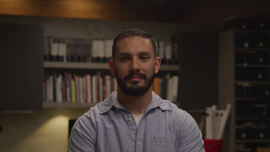 A man is standing inside a room