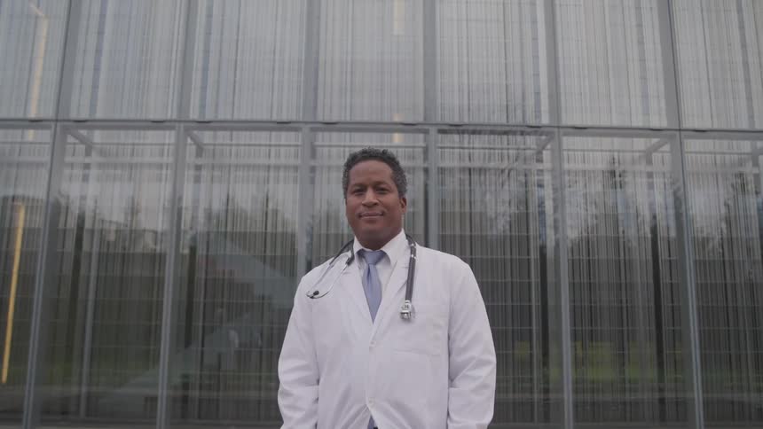 A doctor standing in front of a building