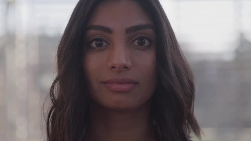 A woman is standing inside a building
