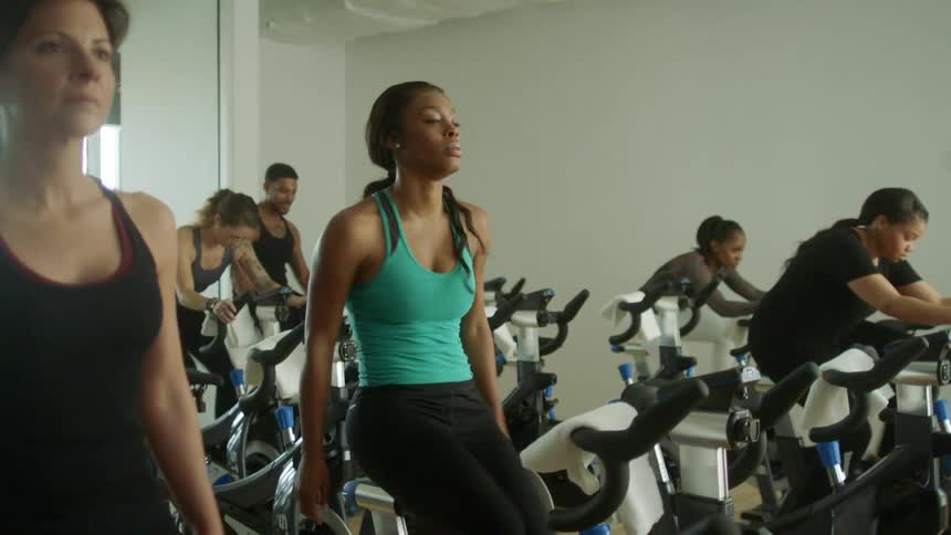 People in spin class in gym