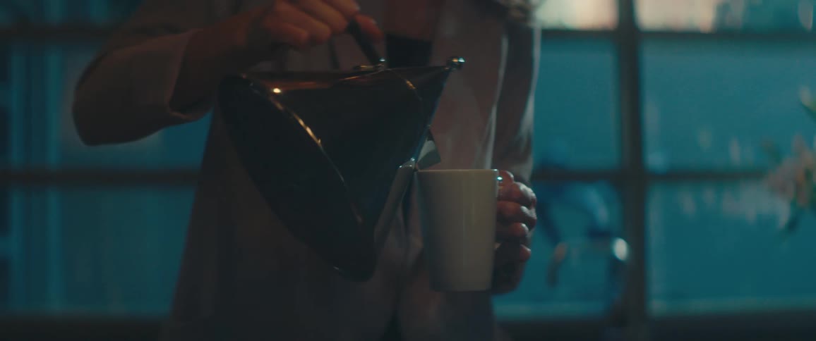 A woman at home making tea