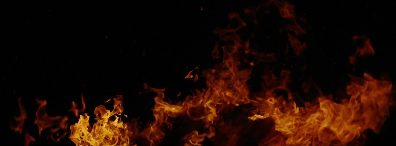 Flames from a campfire grow taller and wider