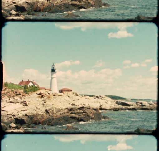 Portland Headlight lighthouse stands in the summer sun along Maine's coast