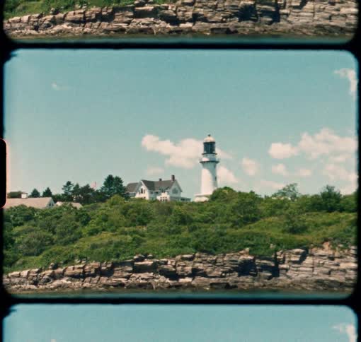 Cape Elizabeth Lighthouse stands nestled in the trees along the Maine coast