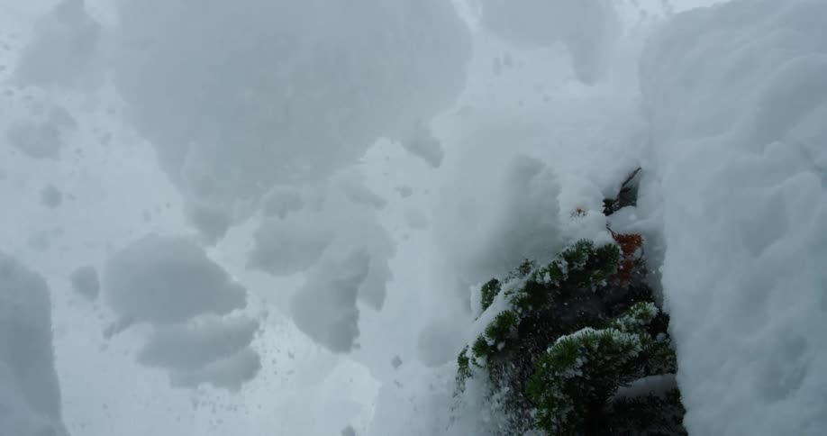 A skier going over a jump on a winter day