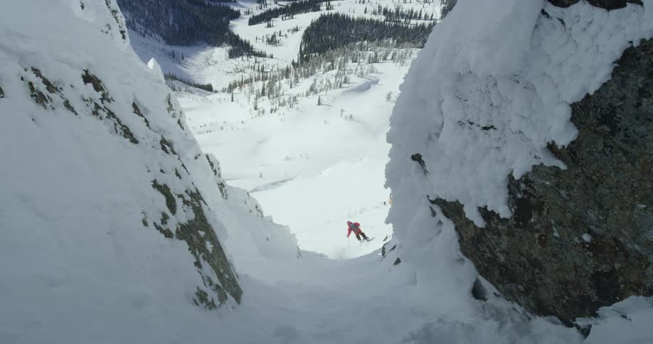 A person skis down a mountain