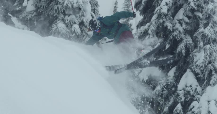 A person flips as they ski down a mountain