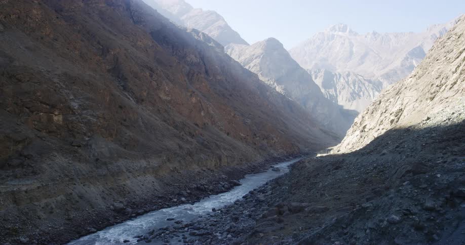 A river is flowing inbetween mountains