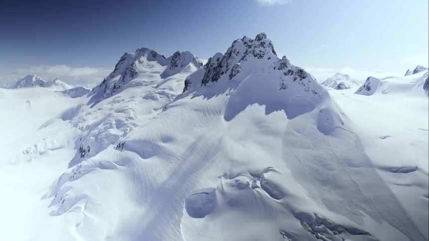 Aerial of a massive glaciated mountain