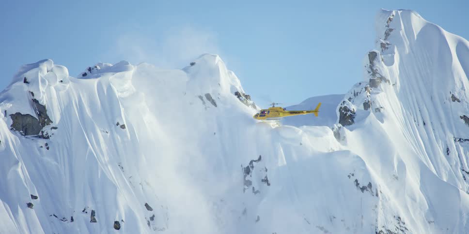 A helicopter is flying in an arctic area