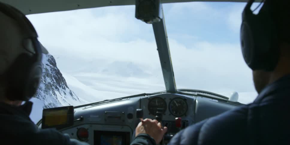 Two people fly a plane together