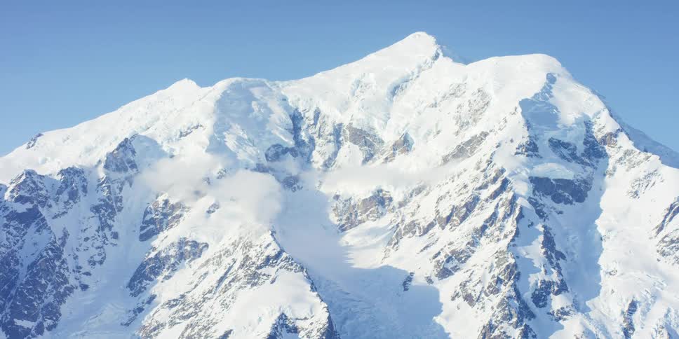 A snow covered mountain is displayed