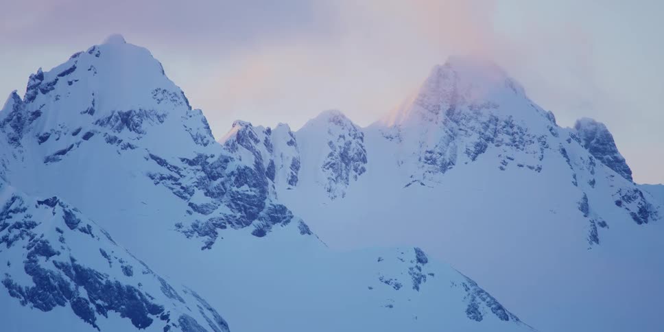 View of snow capped mountains at dusk