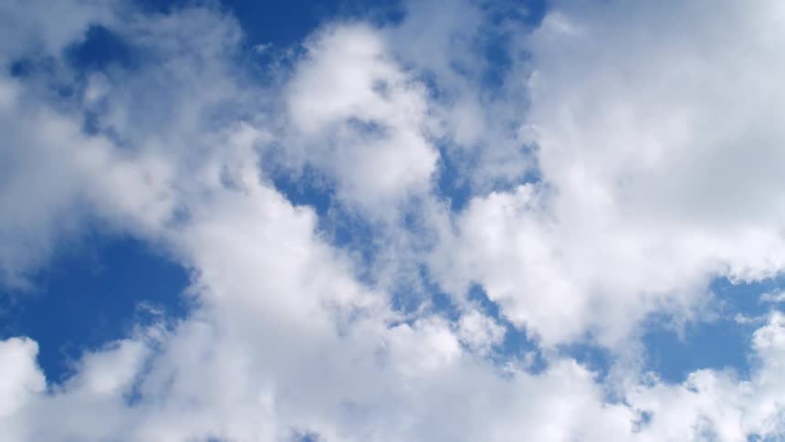 Clouds floating in a bright blue sky