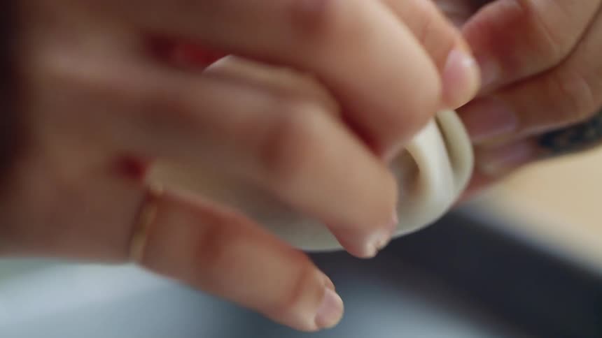 A woman making dumplings