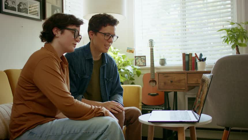 Young couple has video chat on laptop