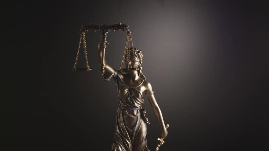 A statue of lady justice blindfolded and holding scales