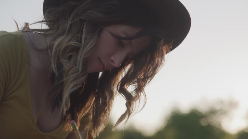 A woman is looking down outside