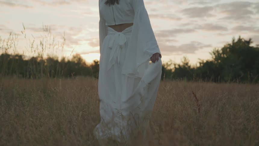A woman walking through a field